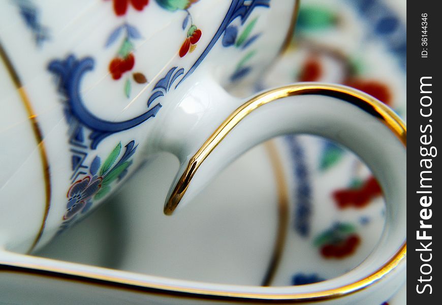 Abstract view of a gold trimmed old teacup. Abstract view of a gold trimmed old teacup.