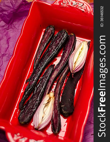 Baked purple carrots and onions