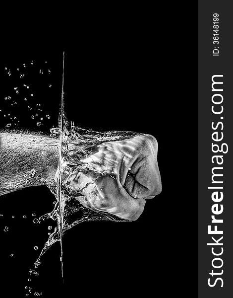 Splashing fist in black and white