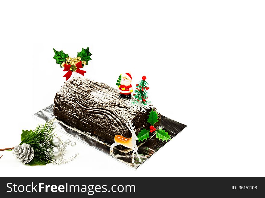 Beautiful Christmas log cake and Santa Claus on top.