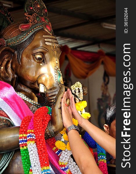 People prayers to Lord Ganesha for invoke his blessing for luck. People prayers to Lord Ganesha for invoke his blessing for luck.