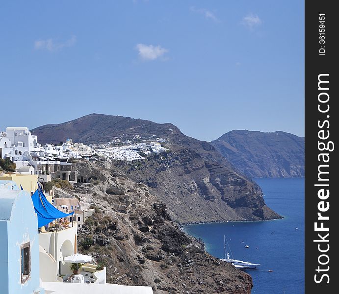 Summer landscape coast of the Greek island of Santorini in the Aegean sea. Summer landscape coast of the Greek island of Santorini in the Aegean sea.