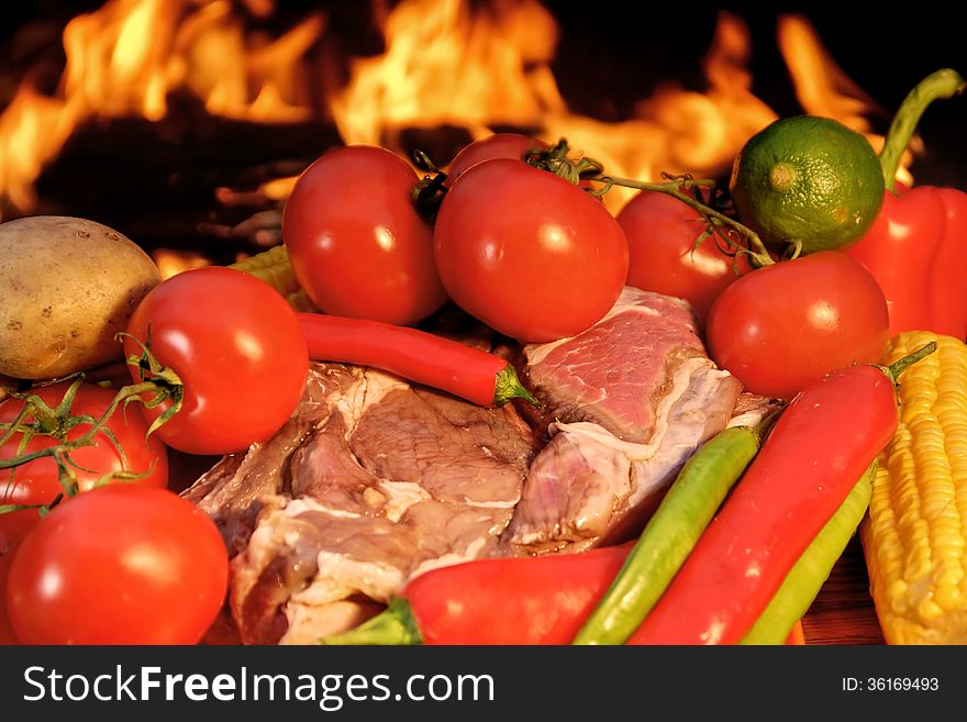 Fresh Rib steak and vegetables at the flames of coal BBQ facilities. Fresh Rib steak and vegetables at the flames of coal BBQ facilities