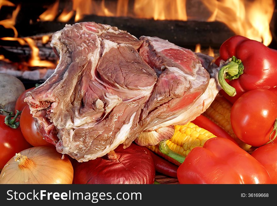 Fresh Rib steak and vegetables at the flames of coal BBQ facilities. Fresh Rib steak and vegetables at the flames of coal BBQ facilities