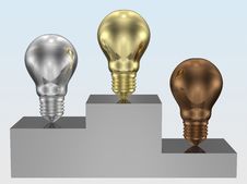 Golden, Silver And Bronze Light Bulbs On Pedestal Royalty Free Stock Images Golden, Silver And Bronze Light Bulbs On Pedestal Royalty Free Stock Images