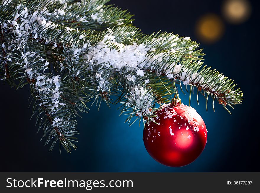 Snow-covered fir tree branch with hanging Christmas Bell. Snow-covered fir tree branch with hanging Christmas Bell