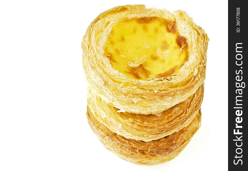 Triple stack tower of delicious eggtart on white background. Triple stack tower of delicious eggtart on white background