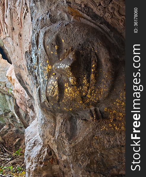 The Stucco Of Ancient Reclining Buddha At The Khao Ngu Cave In T