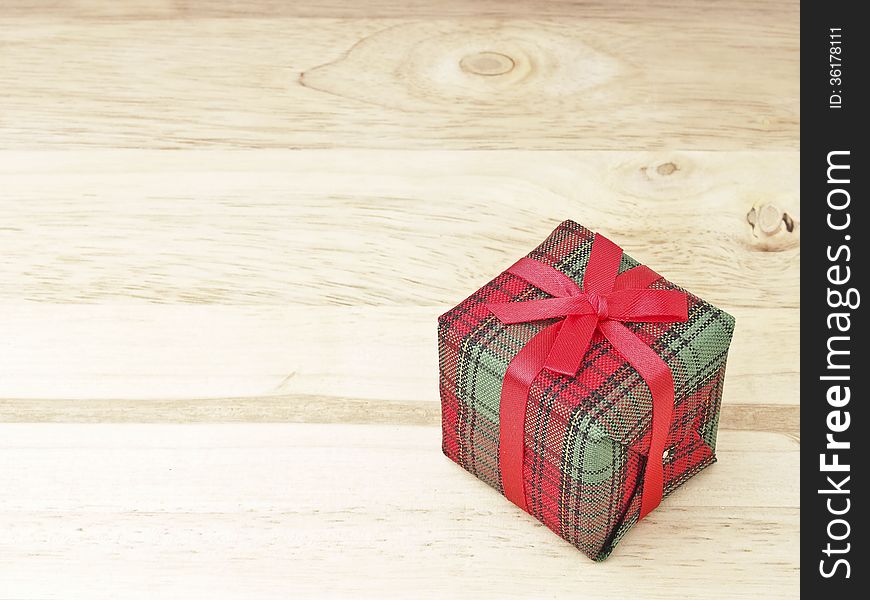 Red gift box decorate on wood background. Red gift box decorate on wood background