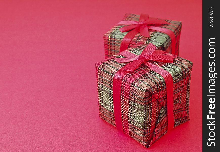 Line arrange of two red gift box on red background. Line arrange of two red gift box on red background
