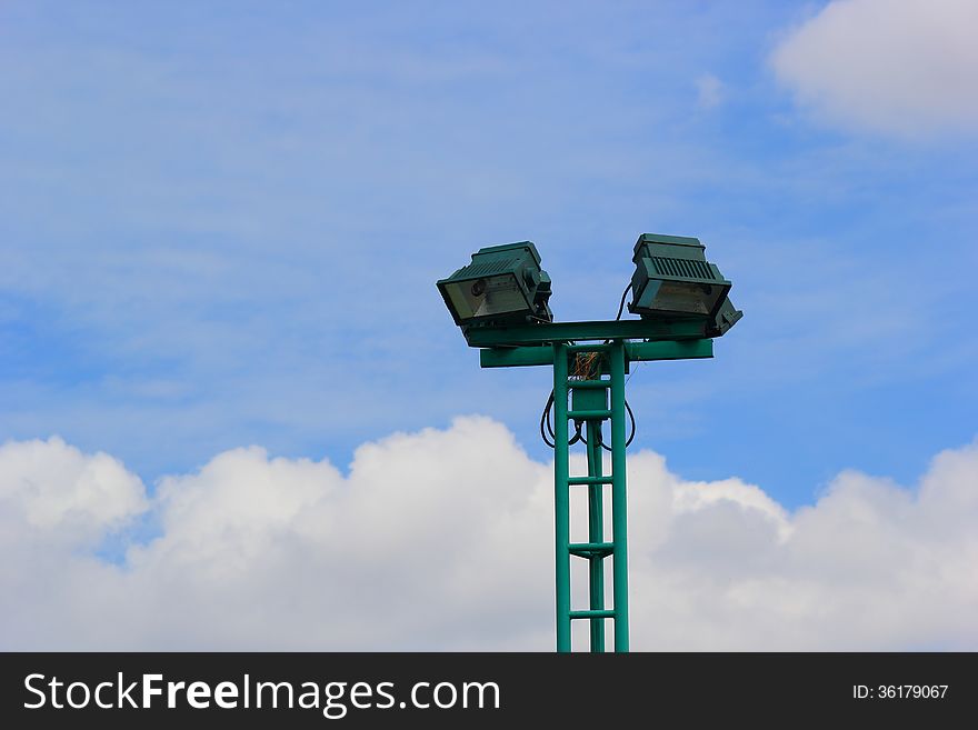 Light Poles In The Park , Spotlights Post On Blue Sky