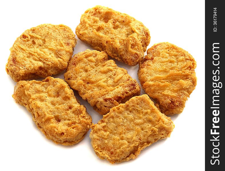 Delicious chicken nuggets on a white background
