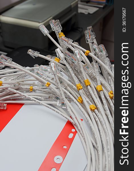 A bunch of gray network cables close up link