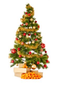 Christmas Tree With Gifts And Mandarines Royalty Free Stock Photos
