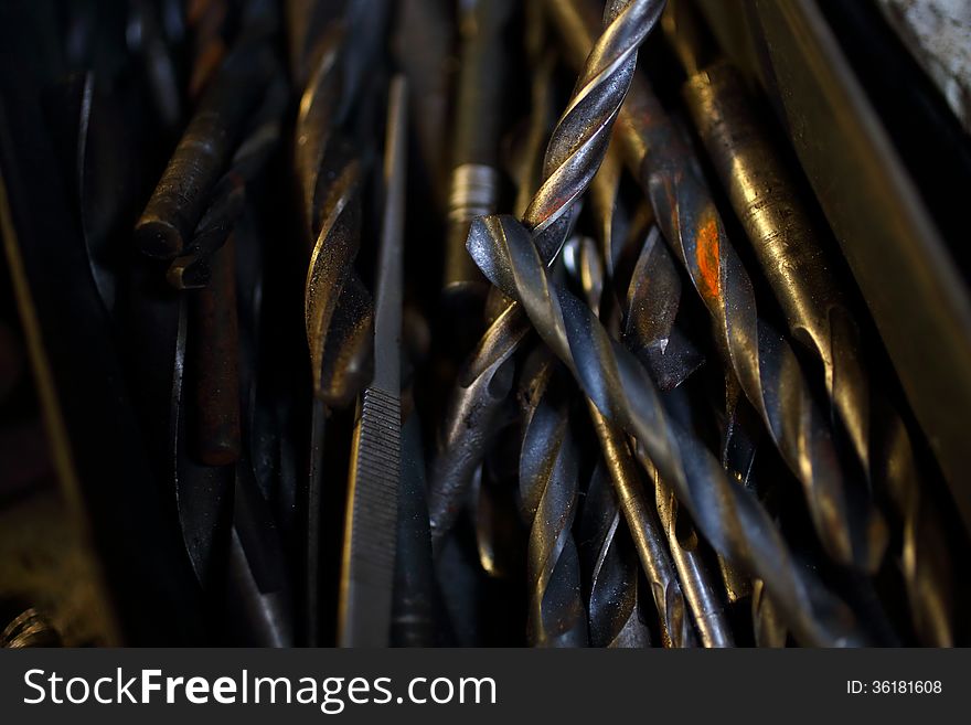 Old rusty drill bits in a box