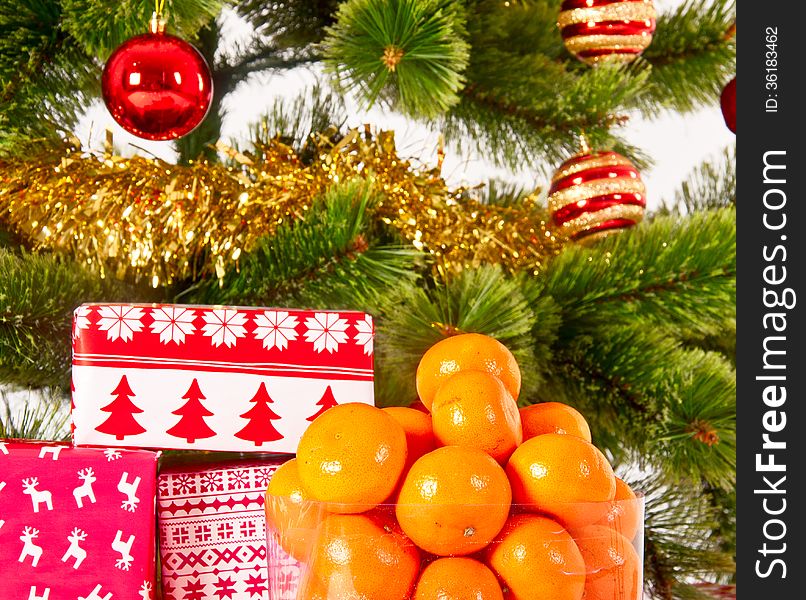 Christmas tree with gifts and presents and mandarines, isolated on white. Christmas tree with gifts and presents and mandarines, isolated on white