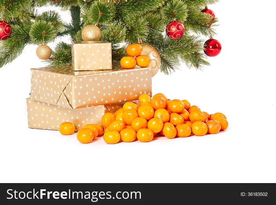 Christmas tree with gifts and presents and mandarines, isolated on white. Christmas tree with gifts and presents and mandarines, isolated on white