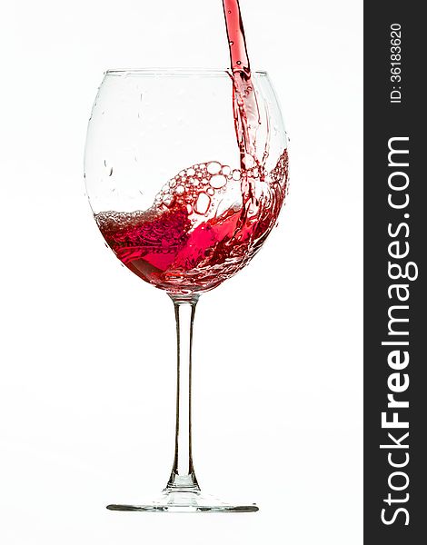 Red wine pouring into the glass. Red wine pouring into the glass