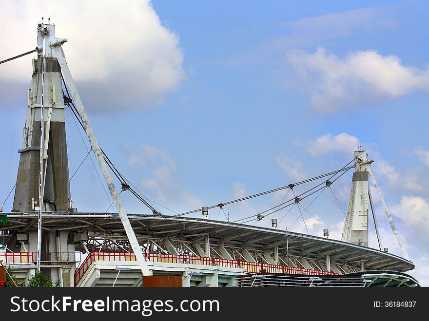 Reinforced concrete structures of large sports facility with supporting pillars and steel cables. Reinforced concrete structures of large sports facility with supporting pillars and steel cables