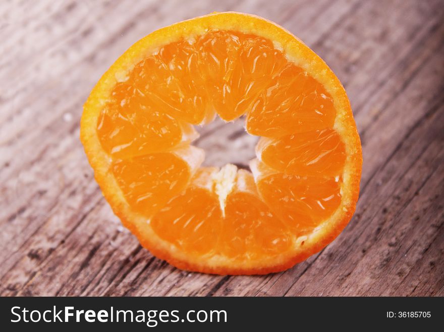 Peeled orange on the dark background (details)