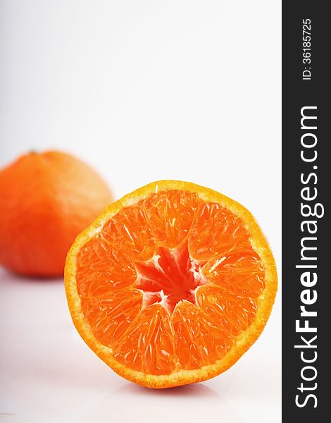 Peeled Orange On The White Background