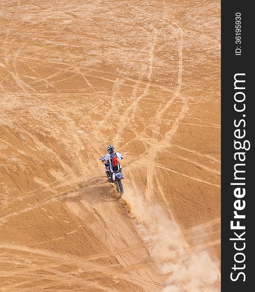 Racer On A Motorcycle Ride Through The Desert