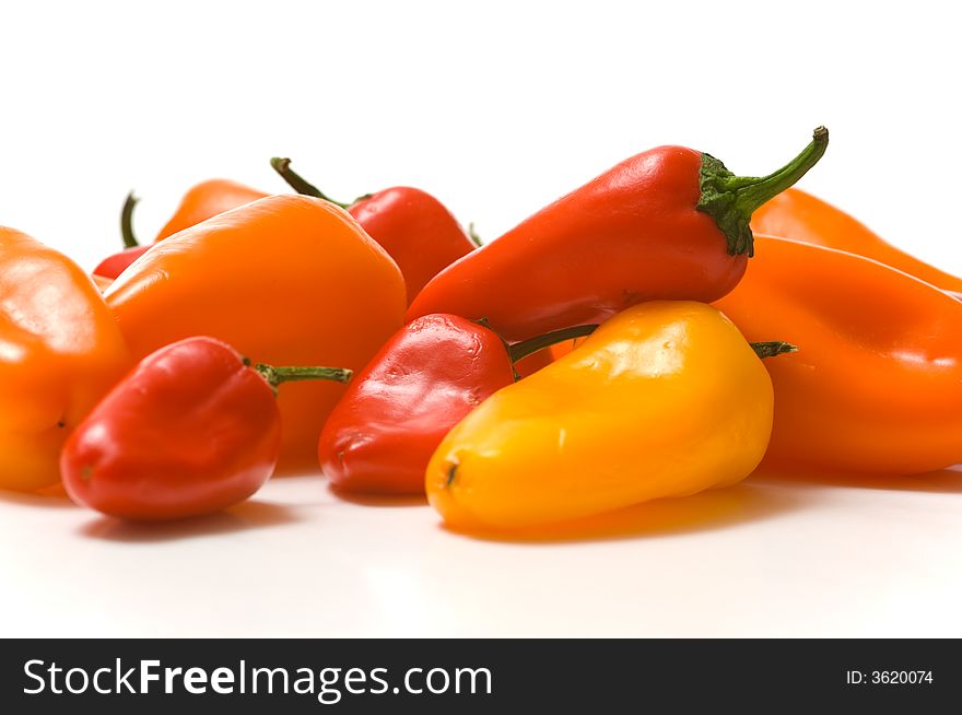 Fresh sweet peppers on white background, with copy space