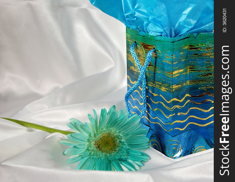 Pretty gift bag on white satin with chrysanthemum. Pretty gift bag on white satin with chrysanthemum.