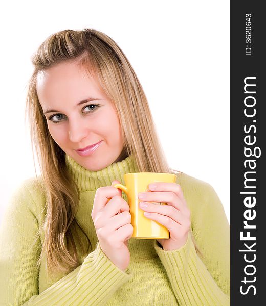 Young woman sitting down with a cup of tea