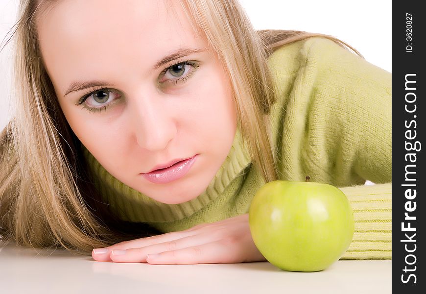 Young woman and green apple