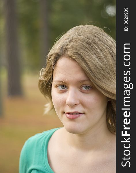 Portrait of a girl with the wind blowing through her hair. Focus is only centered around the eyes. Portrait of a girl with the wind blowing through her hair. Focus is only centered around the eyes