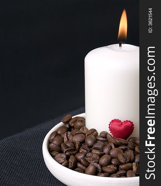 candle, coffee beans and red hearts