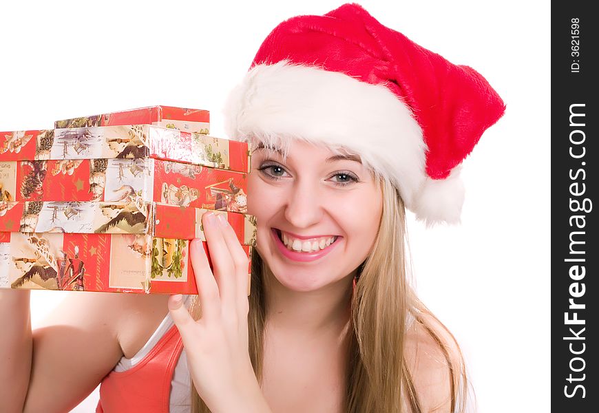 Smiling women wearing a santa hat and holding some gift box