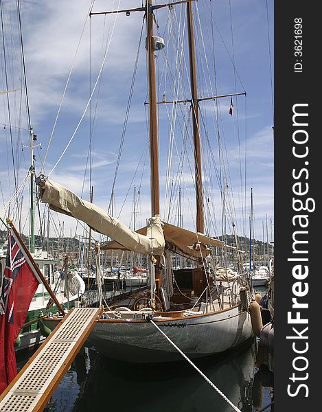 Sailing ship in harbor in summer time