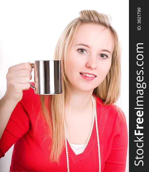 A beautiful young woman drinking a hot cup of coffee