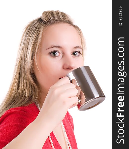 A beautiful young woman drinking a hot cup of coffee