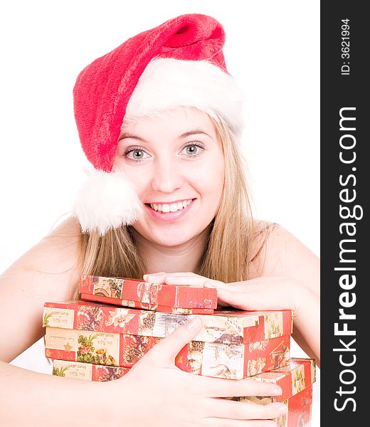 Smiling blonde women wearing a santa hat and holding some gift box