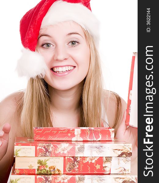 Smilling girl and christmas presents.