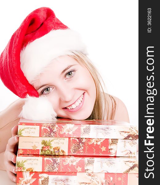 Attractive woman holding christmas gifts.