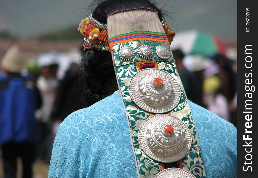 White silver made head wear(accessories) worn by a tibetan woman. White silver made head wear(accessories) worn by a tibetan woman