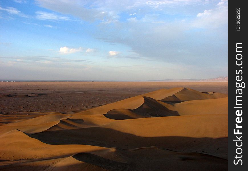 Wide desert has light side and shadow. Wide desert has light side and shadow