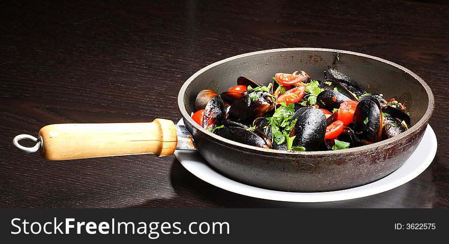 Mussel stew (ragout) on the frying pan