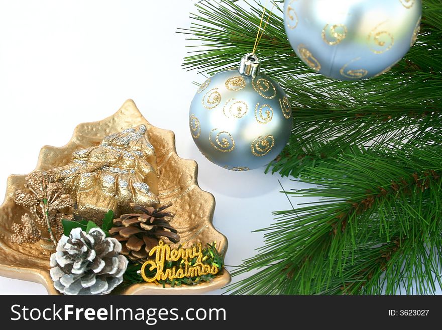 Christmas ornaments.Gray balls,cones,candle,fir-tree.