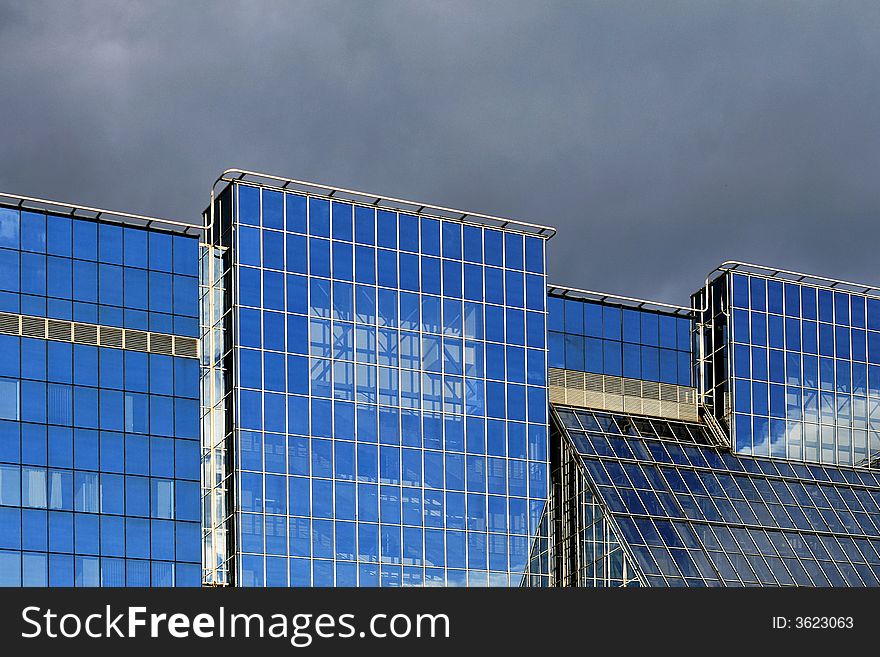 Business building with blue glass and reflections. Business building with blue glass and reflections