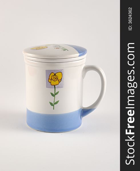 A mug with flower in the table