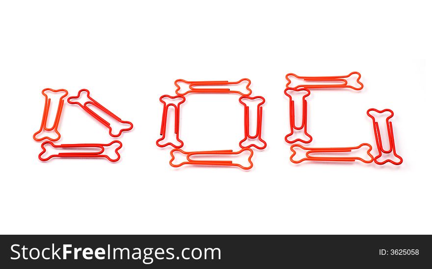 Colored bone-shaped paper clips isolated on white forming the word dog