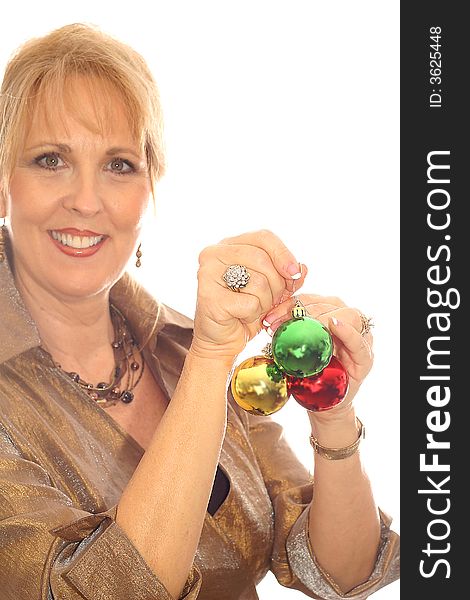 Shot of a woman with lots of Christmas ornaments