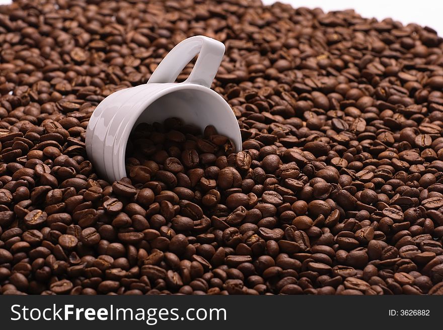 Cup with coffee, costing on coffee grain. Cup with coffee, costing on coffee grain