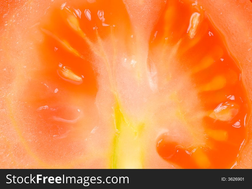 Macro of a fresh tomato for backgrounds. Macro of a fresh tomato for backgrounds