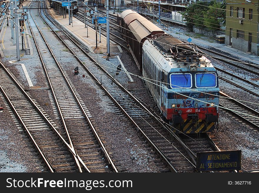 An old train leaving the station.